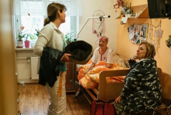 caregiver-visiting-senior-in-bedroom-assisted-living-support