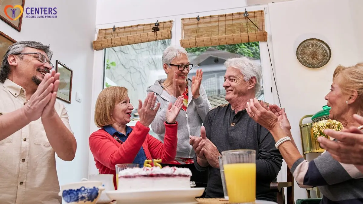 older-adults-applauding-during-birthday-celebration-around-table